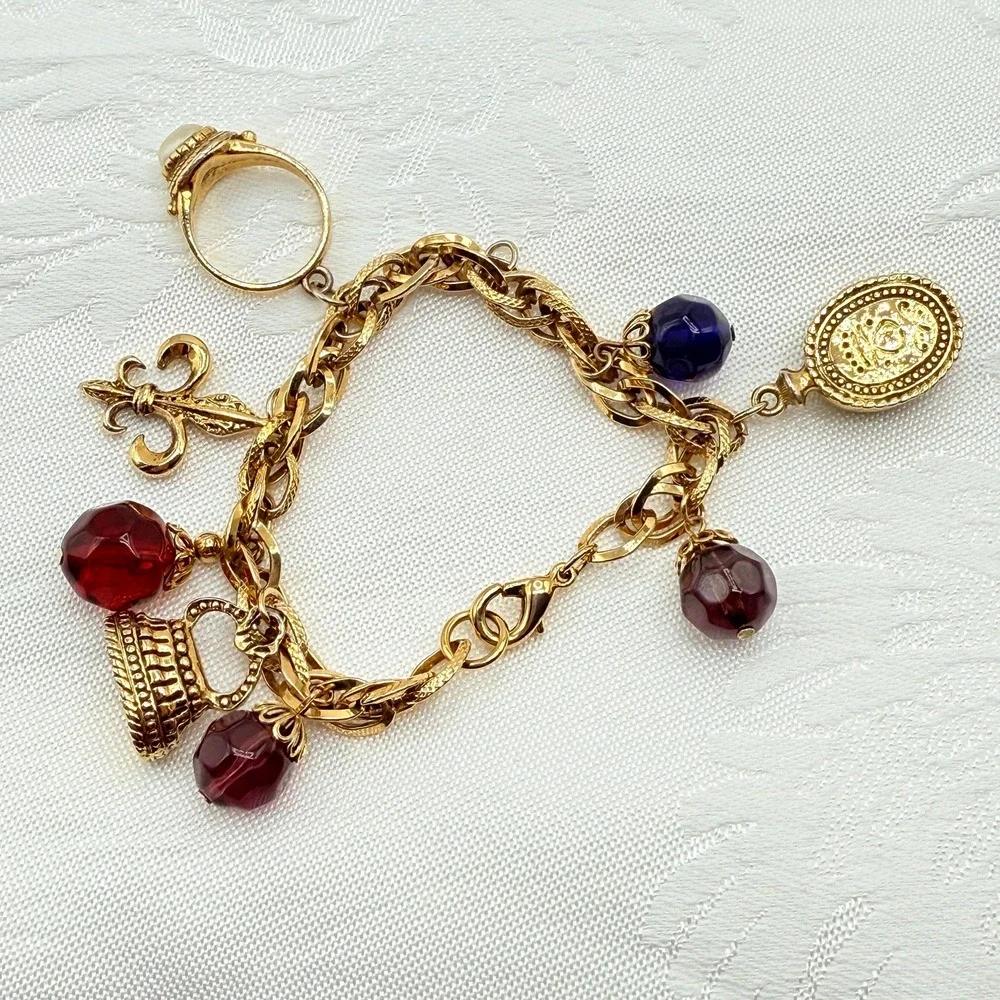 Vintage Gold Tone Charm Bracelet w/ Fleur de Lis, Ring, and Faceted Glass Beads